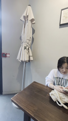 Compact indoor seating at Kompass Coffee